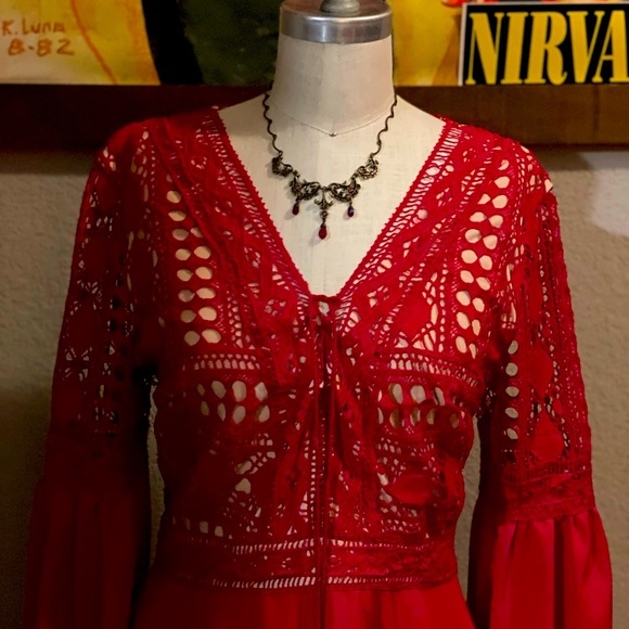 Brand new red dress, embroidered top and flows out just above the knees. - Picture 3 of 5